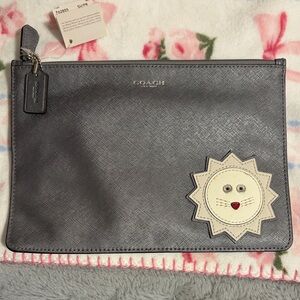 Coach Silver Clutch with Lion Design